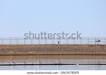 View of  the stretch of the walking trail over the dam at Lake Miramar in San Diego, California.