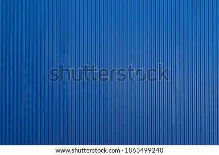 blue corrugate metal sheet background and texture. blue cargo panel wall. Royalty-Free Stock Photo #1863499240