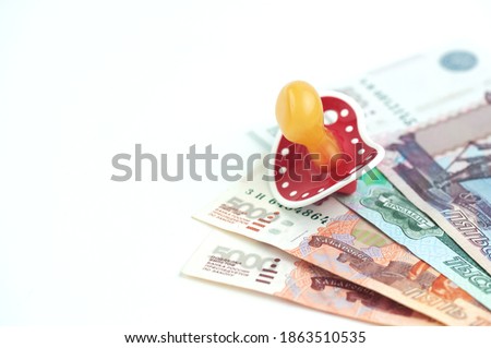 Russian money and a dummy, the concept of increasing fertility Royalty-Free Stock Photo #1863510535