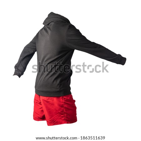 black sweatshirt with an iron zipper with a hood and red sports shorts isolated on a white background. casual sportswear