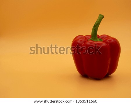 One red pepper on a gold fortune background