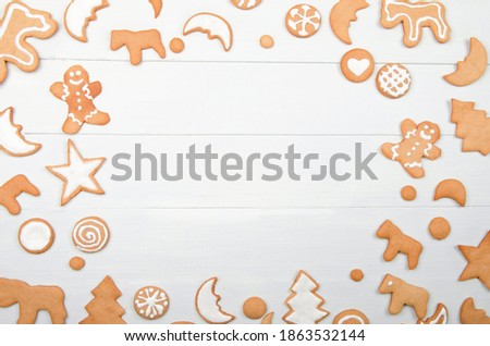 ?hristmas frame with homemade cookies on wooden background