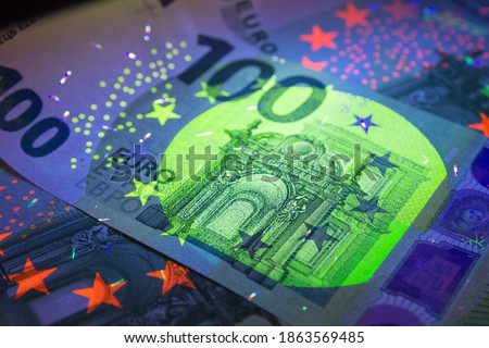 Various security features have been incorporated into all euro banknotes to protect them against counterfeiting Royalty-Free Stock Photo #1863569485