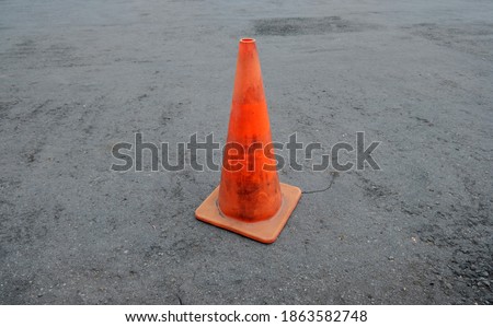 Isolated orange cone. Traffic Cone On Street