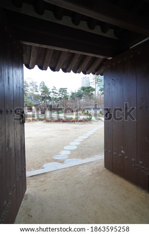Opened Korean style door facing a garden
