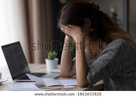 Frustrated desperate young woman received correspondence letter with bad news feeling depressed sitting at table, dismissal lost job notice, bank loan rejection or financial debt notification concept. Royalty-Free Stock Photo #1863655828