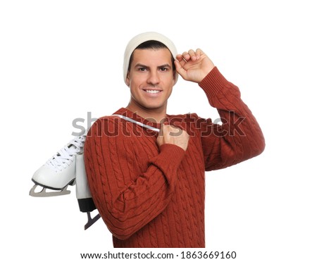 Happy man with ice skates on white background