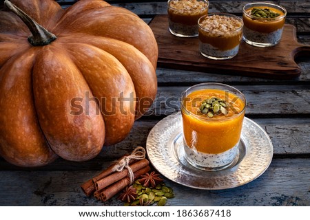 Homemade pumpkin dessert in the glass. Autumn dessert, pumpkin mousse in the glasses