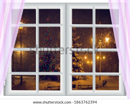view from the window before the holiday Christmas tree is decorated with a colorful garland