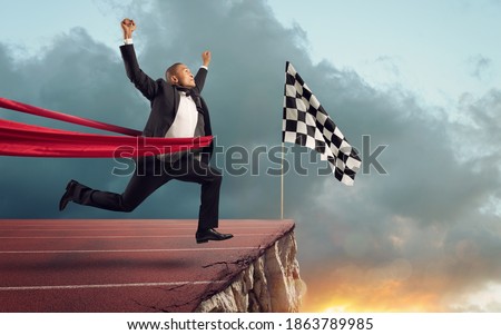 Businessman thinks she has won but there is a precipe after the finishline