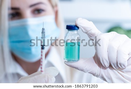 Medical treatment vaccine and syringe for injections. Prevention and treatment of coronary infection. Medicine is an infectious concept. Royalty-Free Stock Photo #1863791203