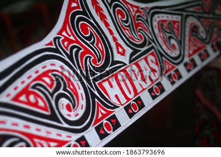 carving, gorga Batak, carving of traditional Batak culture - red, black and white                              