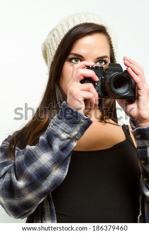 Female photographer frames a picture