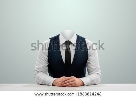 Businessman in a white shirt, vest and headless tie on a light background. Copy space Royalty-Free Stock Photo #1863814246
