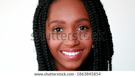 Happy black teen girl smiling at camera, portrait millennial Mixed race african descent