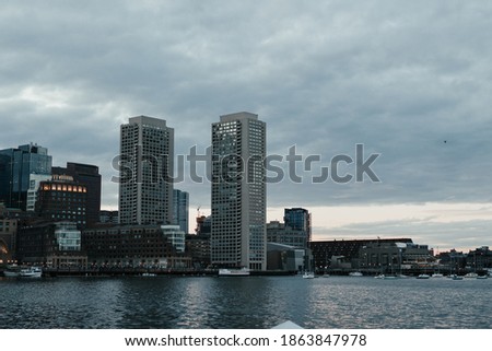 Cityscape over water on a cloudy day
