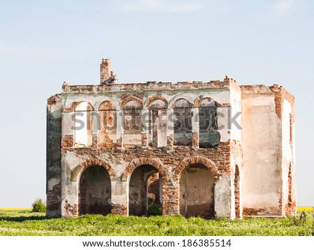 Ruined house walls with blue sky 