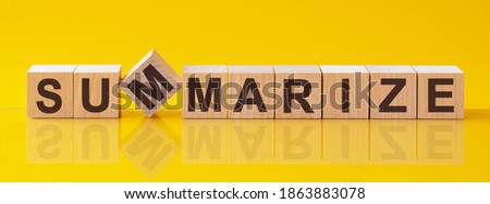 summarize word written on wood block. content word is made of wooden building blocks lying on the yellow table. summarize, business concept, yellow background Royalty-Free Stock Photo #1863883078