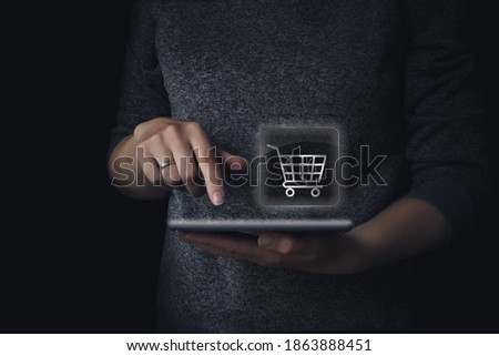 Icon marcet cart on tablet In The Hand. Ordering Food Online At Home. Online shopping concept tech on e-commerce . Internet Shoping Concept Royalty-Free Stock Photo #1863888451
