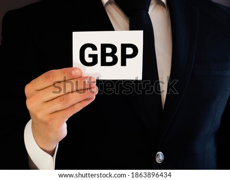 GBP text written on white card