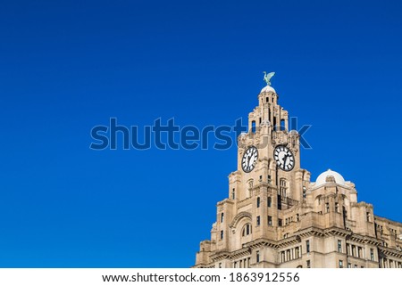 The Royal Liver Building on the world famous Liverpool skyline pictured against a clear blue sky.