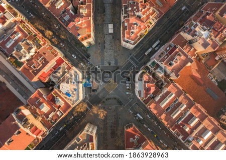 Aerial overhead drone photo of crossroad near St Paul in Barcelona in morning