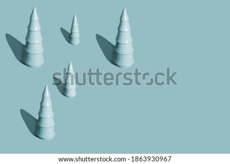 Minimal Christmas background with Christmas trees trendy concept pattern Cerulean french blue