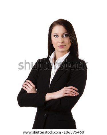 Businesswoman wearing a suit and confidently standing against white background
