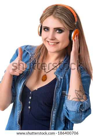 Smiling young girl in headphones on a white background