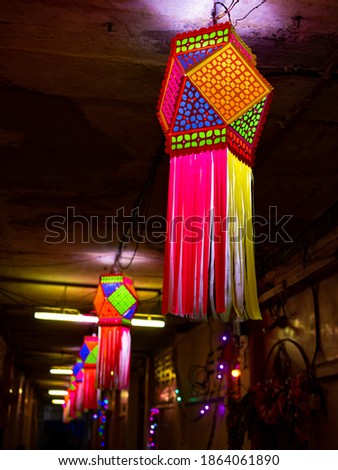 Diwali decorative lamps - Akash Kandil or Lantern lights hanging outside traditional Indian home or Chawl in Mumbai Royalty-Free Stock Photo #1864061890