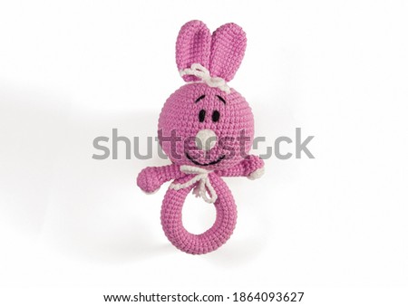 handmade knitted toy on a white background.