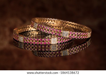Bangle, Indian bracelets isolated on thedark background Royalty-Free Stock Photo #1864138672