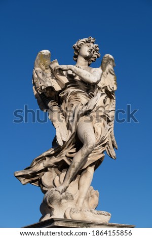 Angel with the Superscription statue on Ponte Sant Angelo bridge in Rome, Italy. Marble sculpture from 17th century, design of Gian Lorenzo Bernini Royalty-Free Stock Photo #1864155856
