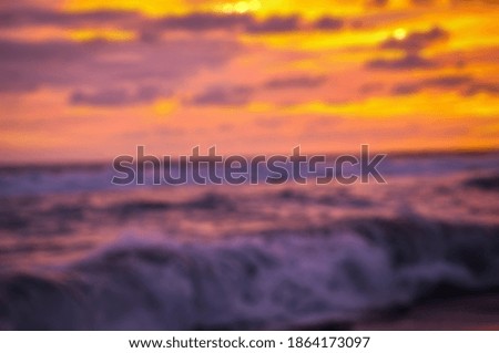 light from sun setting on beach with blur photo