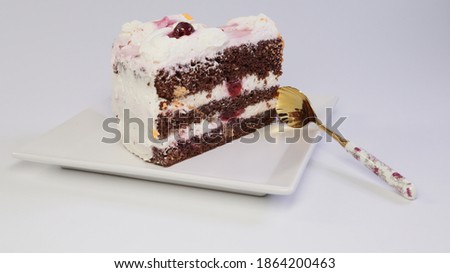 chocolate cake with white cream on a plate