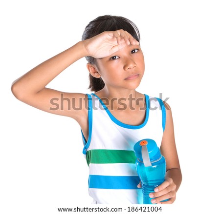 Young Asian Malay girl with water bottle in an athletic attire over white background