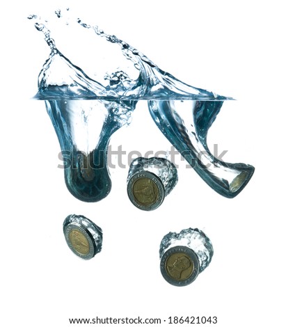 money in water with bubbles on white background