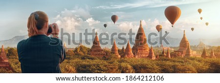 Woman traveller in ancient Bagan enjoying panoramic view at sunset, Myanmar, Asia.
Traveling along Asia, active and adventure lifestyle concept.