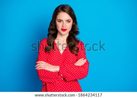 Photo of young attractive beautiful confident smiling charming woman look camera with crossed hands isolated on blue color background