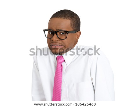 Closeup portrait, young nerdy looking man with glasses, very timid, suspicious shy and anxious looking at camera, isolated white background. Mental health, emotion facial expression feeling