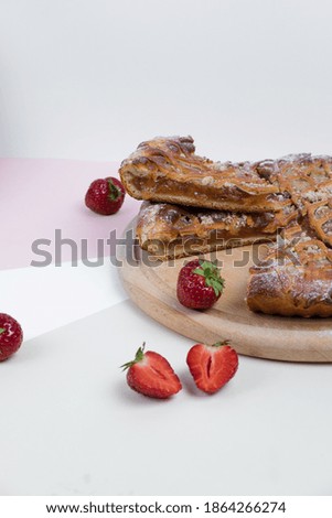 Strawberry pie on a light background with fresh strawberries