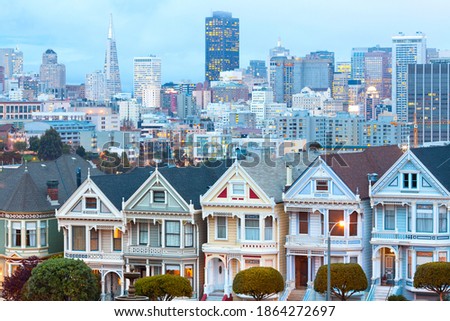 Traditional Victorian Houses at Alamo Square and downtown skyline, San Francisco, California, USA