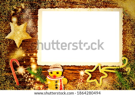  Christmas retro photo frame greeting card. Old empty photo frame to put a photo surrounded by vintage ornaments on old wooden background