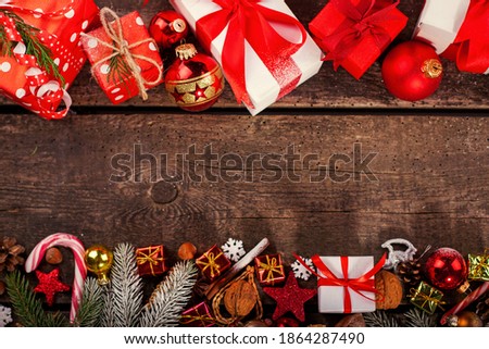 Gift box in wrapping paper with satin ribbon. Merry Christmas holiday concept.