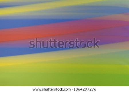 Abstract blurred pattern background with colorful horizontal stripes in green, red and blue colors. Graphic resource for web design, banner or presentation
