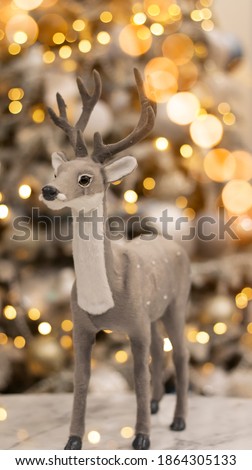 Christmas festive background, fir tree with bokeh lights. Fabulous deer on a bokeh, background for a postcard.