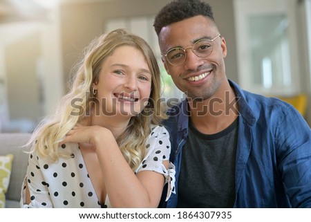 Portrait of cute 30-year old mixed-raced couple 