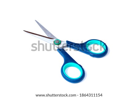 Navy blue scissors isolated on white background.