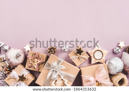 Festive Christmas background with different size gift boxes and Christmas decorations. Top view. Copy space for text.