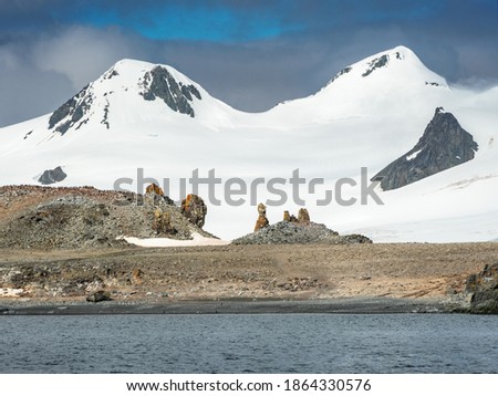 mountain view to the rock and snow peaks in summer day in Antarctica